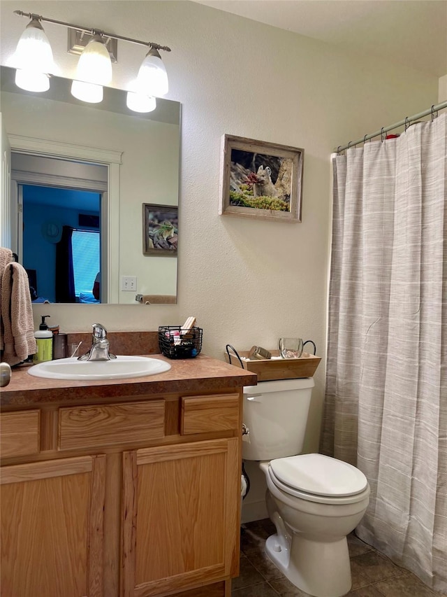 50 Rockefeller Dr, Kalispell, MT 59901 - full bath featuring vanity, tile patterned flooring, and curtained shower