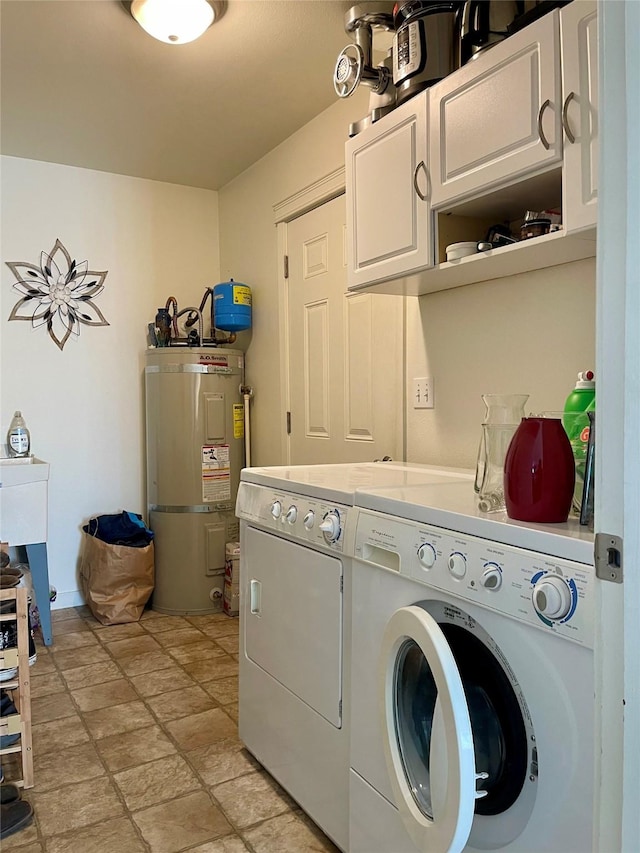 50 Rockefeller Dr, Kalispell, MT 59901 - washroom with cabinet space, secured water heater, washer and dryer, and stone finish floors