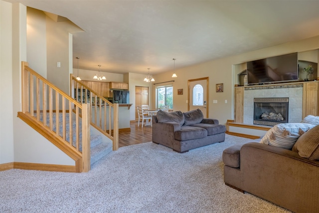 310 Barney St Unit B, Helena, MT 59602 - living room with carpet flooring, a chandelier, stairs, and a tile fireplace