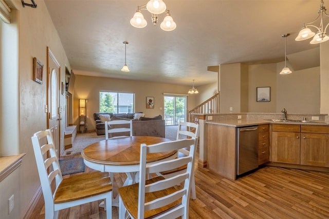310 Barney St Unit B, Helena, MT 59602 - dining area with a chandelier and light wood-style floors