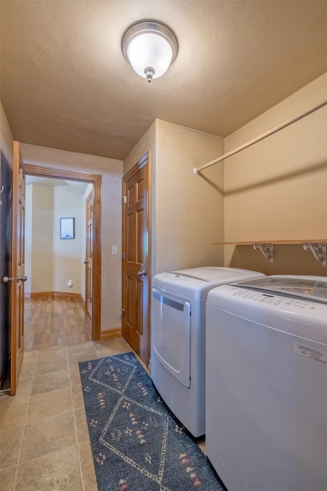 310 Barney St Unit B, Helena, MT 59602 - laundry area with washing machine and clothes dryer and light tile patterned floors