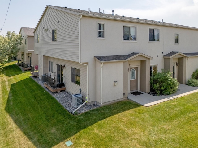 310 Barney St Unit B, Helena, MT 59602 - rear view of property with stucco siding and a lawn