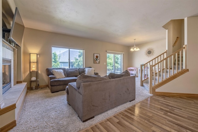 310 Barney St Unit B, Helena, MT 59602 - living area with a chandelier, stairway, and wood finished floors