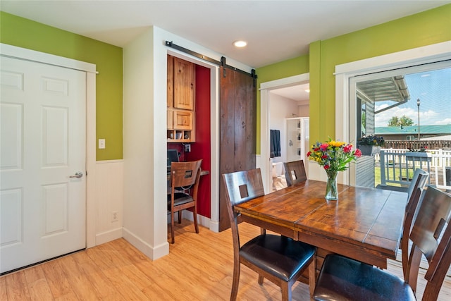 3782 E Riggs St, East Helena, MT 59635 - dining area featuring a barn door, light wood finished floors, and recessed lighting