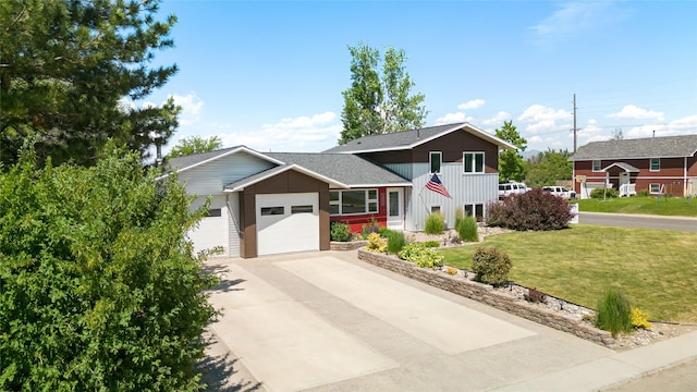 3782 E Riggs St, East Helena, MT 59635 - view of front facade with an attached garage, a front lawn, and driveway