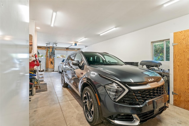 3782 E Riggs St, East Helena, MT 59635 - garage with freestanding refrigerator and a garage door opener