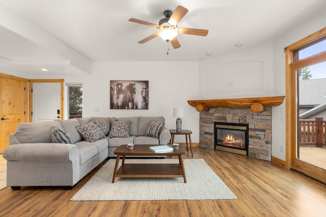 396 N Juniper Bay Rd Unit 15, Somers, MT 59932 - living room with wood finished floors, ceiling fan, a fireplace, and recessed lighting