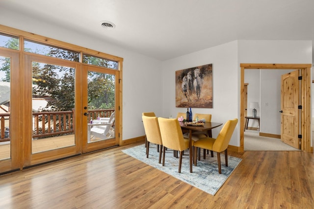 396 N Juniper Bay Rd Unit 15, Somers, MT 59932 - dining space featuring wood finished floors and french doors