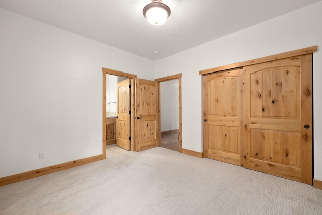 396 N Juniper Bay Rd Unit 15, Somers, MT 59932 - unfurnished bedroom with carpet floors and connected bathroom