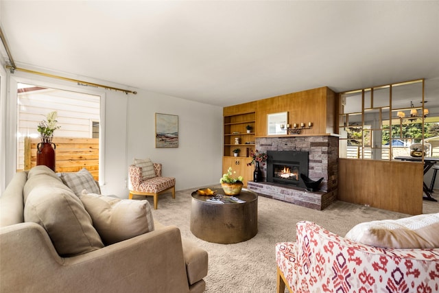 1120 8th Ave E, Kalispell, MT 59901 - living area featuring carpet flooring, a warm lit fireplace, wooden walls, and built in features