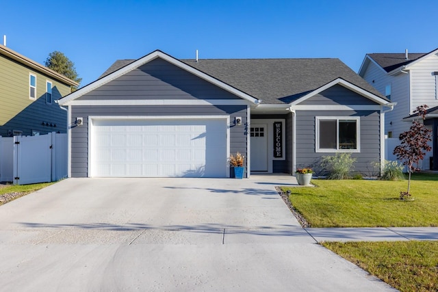 546 Sparrow Rd, Kalispell, MT 59901 - ranch-style house featuring an attached garage, driveway, and a shingled roof