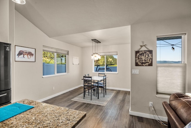 546 Sparrow Rd, Kalispell, MT 59901 - dining area featuring dark wood-style floors and a chandelier