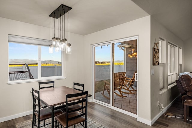546 Sparrow Rd, Kalispell, MT 59901 - dining room featuring dark wood finished floors and a chandelier