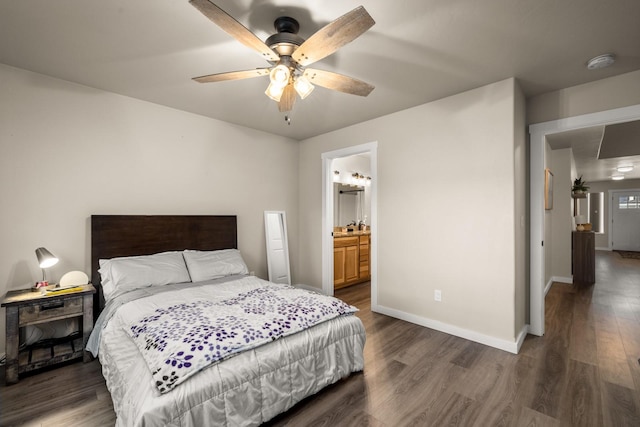 546 Sparrow Rd, Kalispell, MT 59901 - bedroom featuring dark wood-style flooring, a ceiling fan, and connected bathroom