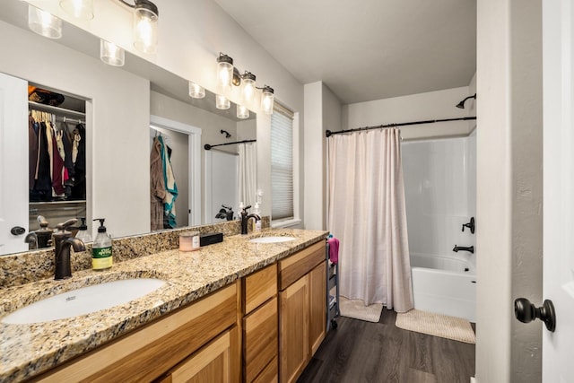 546 Sparrow Rd, Kalispell, MT 59901 - full bath with shower / tub combo, wood finished floors, double vanity, and a walk in closet