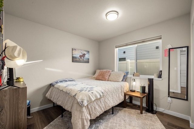 546 Sparrow Rd, Kalispell, MT 59901 - bedroom with wood finished floors and baseboards