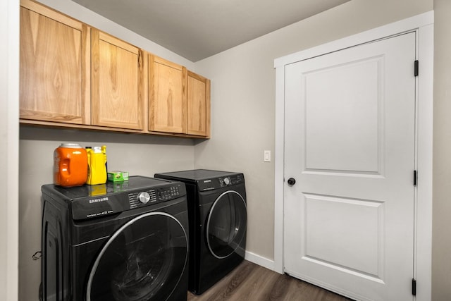 546 Sparrow Rd, Kalispell, MT 59901 - laundry room with cabinet space, washer and clothes dryer, and dark wood-style floors
