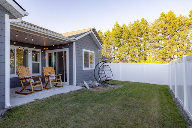 546 Sparrow Rd, Kalispell, MT 59901 - fenced backyard featuring a patio area