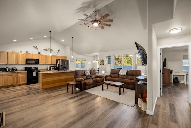 546 Sparrow Rd, Kalispell, MT 59901 - living area featuring high vaulted ceiling, a ceiling fan, light wood finished floors, and recessed lighting