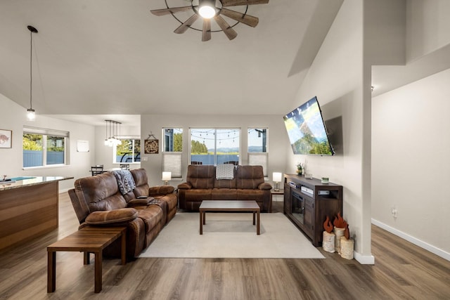 546 Sparrow Rd, Kalispell, MT 59901 - living area featuring ceiling fan, wood finished floors, and high vaulted ceiling