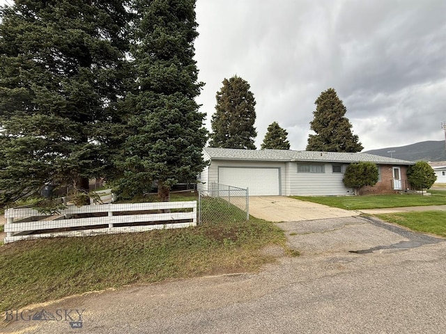 2625 George St, Butte, MT 59701 - view of front of home featuring concrete driveway and a garage