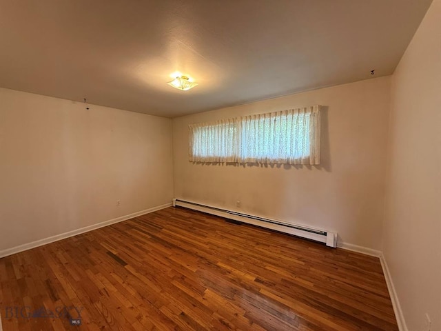 2625 George St, Butte, MT 59701 - empty room featuring baseboard heating and wood finished floors