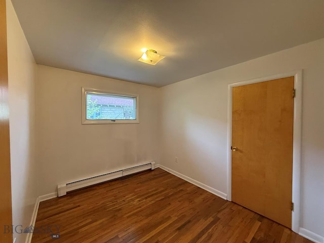2625 George St, Butte, MT 59701 - spare room with a baseboard radiator and wood finished floors