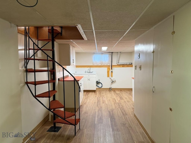 2625 George St, Butte, MT 59701 - hallway with stairs, wood finished floors, and a paneled ceiling
