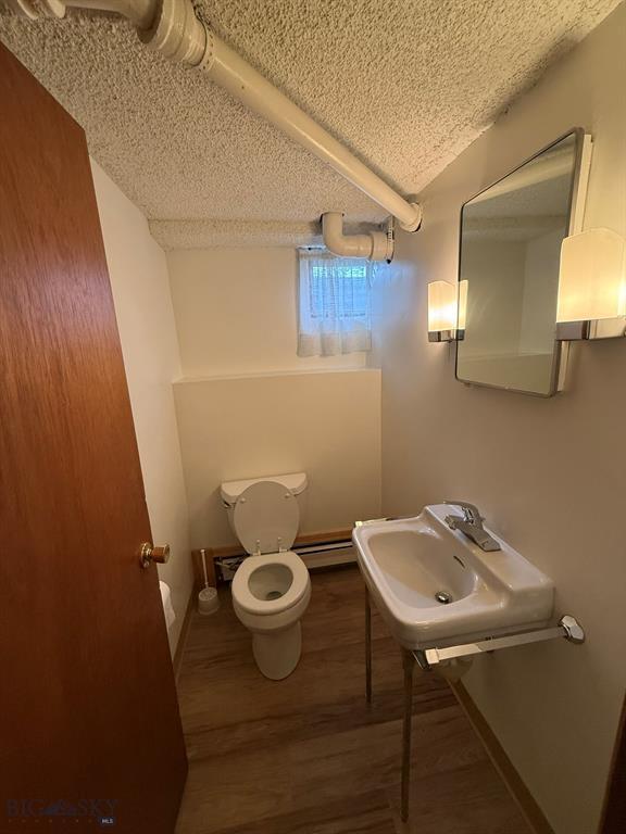 2625 George St, Butte, MT 59701 - bathroom with wood finished floors and a textured ceiling
