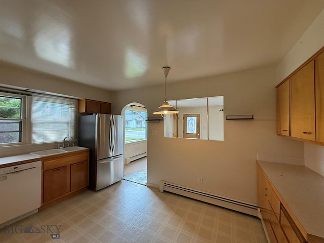 2625 George St, Butte, MT 59701 - kitchen featuring white dishwasher, a baseboard radiator, freestanding refrigerator, and light flooring