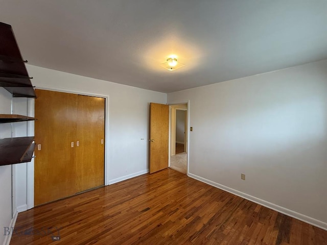 2625 George St, Butte, MT 59701 - unfurnished bedroom with wood finished floors and baseboards