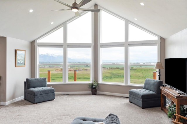 132 Skyview Ln, Polson, MT 59860 - living room with plenty of natural light, a ceiling fan, carpet floors, a mountain view, and recessed lighting