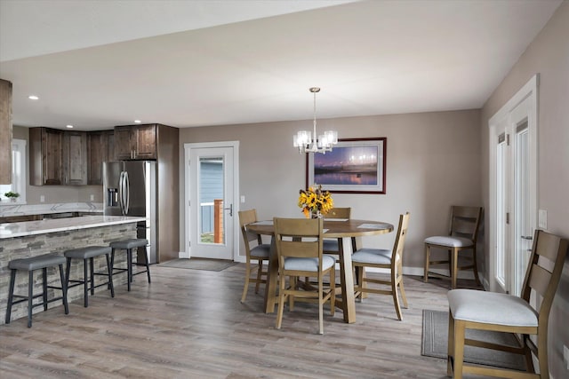 132 Skyview Ln, Polson, MT 59860 - dining space with light wood finished floors, a chandelier, recessed lighting, and healthy amount of natural light