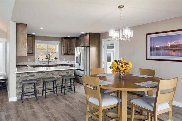 132 Skyview Ln, Polson, MT 59860 - dining room with wood finished floors, a chandelier, and recessed lighting