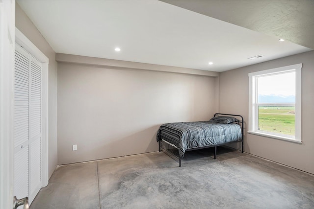 132 Skyview Ln, Polson, MT 59860 - bedroom featuring unfinished concrete flooring and recessed lighting