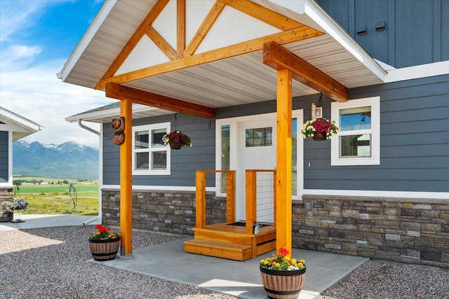 132 Skyview Ln, Polson, MT 59860 - property entrance with stone siding and a mountain view