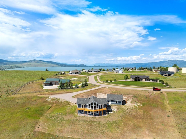 132 Skyview Ln, Polson, MT 59860 - aerial view of property and surrounding area featuring a water and mountain view