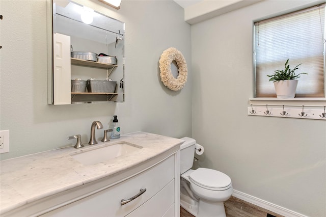 1346 Lilly Ct, Missoula, MT 59802 - half bathroom with vanity and wood finished floors