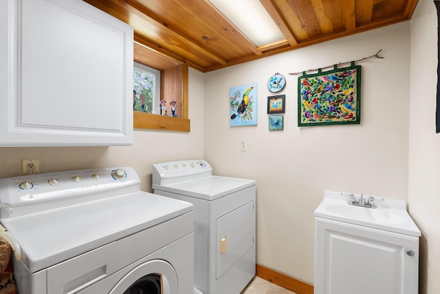 14980 Mt Highway 35, Bigfork, MT 59911 - washroom with independent washer and dryer, wood ceiling, and cabinet space