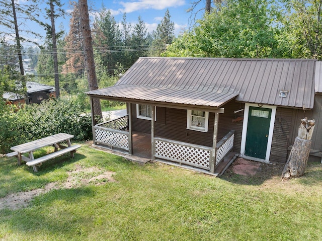 14980 Mt Highway 35, Bigfork, MT 59911 - view of side of property featuring a yard and a metal roof