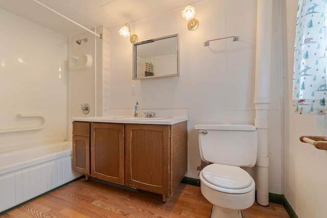 14980 Mt Highway 35, Bigfork, MT 59911 - bathroom with wood finished floors, vanity, and washtub / shower combination