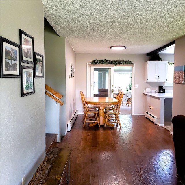 4400 Sierra Dr, Missoula, MT 59804 - dining area with baseboard heating, dark wood-style floors, a textured ceiling, and stairs