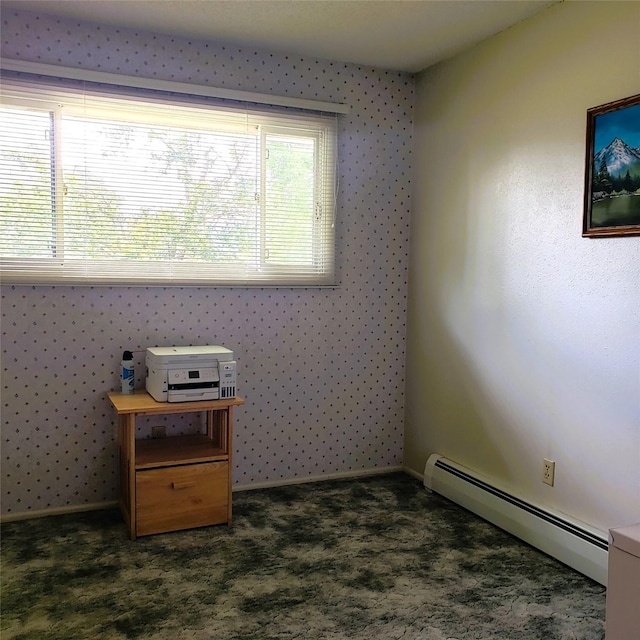 4400 Sierra Dr, Missoula, MT 59804 - spare room featuring baseboard heating and dark colored carpet