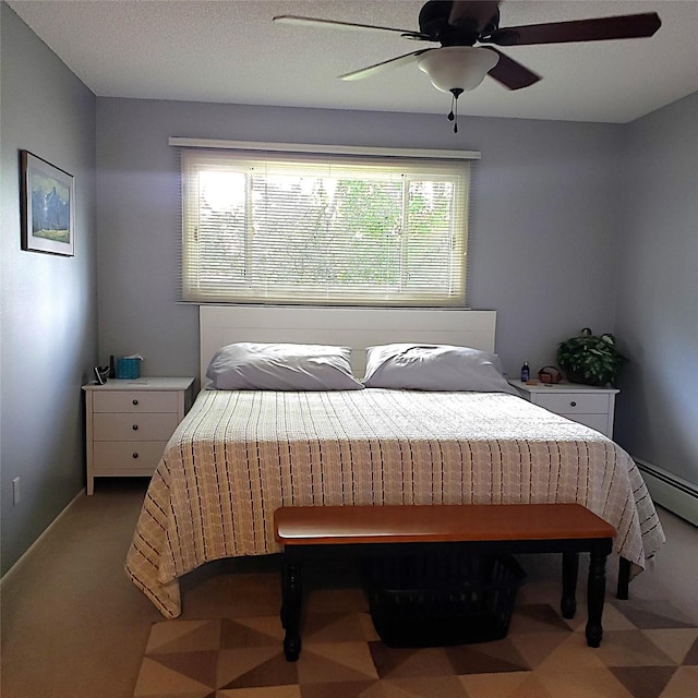 4400 Sierra Dr, Missoula, MT 59804 - bedroom with a ceiling fan and a baseboard radiator