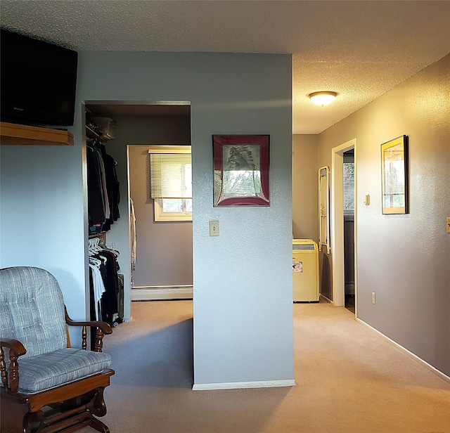4400 Sierra Dr, Missoula, MT 59804 - corridor with baseboard heating, light colored carpet, and a textured ceiling