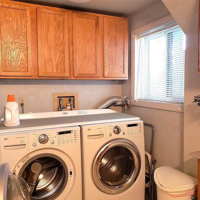 4400 Sierra Dr, Missoula, MT 59804 - laundry room featuring washing machine and dryer and cabinet space