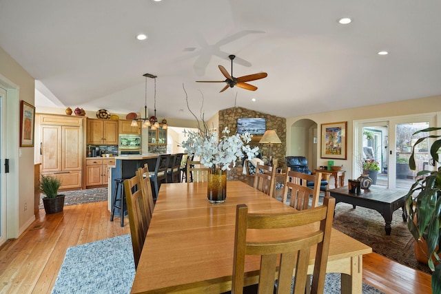 35AND33 Lakeside Ave, Lakeside, MT 59922 - dining space with vaulted ceiling, arched walkways, a ceiling fan, light wood finished floors, and recessed lighting