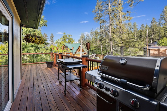35AND33 Lakeside Ave, Lakeside, MT 59922 - deck featuring area for grilling and a playground