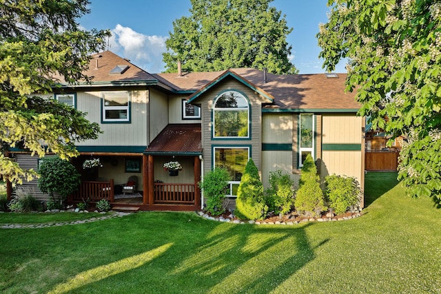 35AND33 Lakeside Ave, Lakeside, MT 59922 - rear view of house with a lawn and a shingled roof
