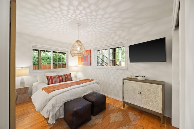 35AND33 Lakeside Ave, Lakeside, MT 59922 - bedroom featuring hardwood / wood-style flooring and wallpapered walls